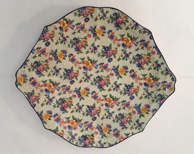 Vintage serving plate from the 50's, decorated with tiny flowers. Produced by Societe Céramique Maestricht Holland