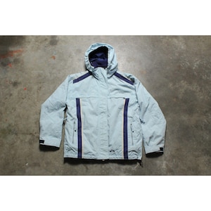 May include: A set of three ceramic mugs with a speckled, matte finish. Each mug features a different color: light blue, cream, and gray. The mugs have a simple, modern design with a rounded shape and a comfortable handle.