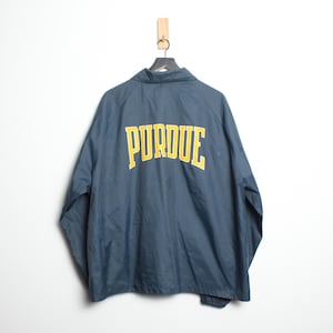May include: A navy blue windbreaker jacket with a yellow "Purdue" logo on the back.