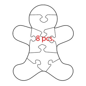 May include: Outline of a gingerbread person puzzle with 8 pieces. The puzzle is made of white paper and has a red text label that says "8 pcs."