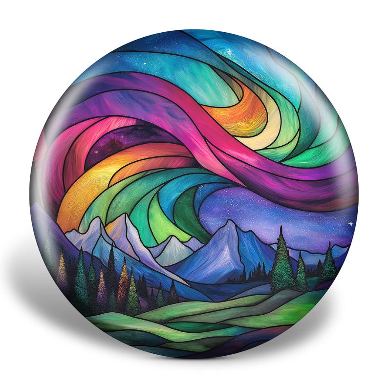 May include: A round, colorful art piece depicting a mountain landscape under a vibrant aurora borealis. The artwork features a swirling display of rainbow colors, including pink, orange, green, and blue, above snow-capped mountains and evergreen trees.