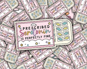 May include: A pink and white sticker with the text "PRESCRIBED Serotonin IS PERFECTLY FINE" and a cartoon image of a pill box with smiley faces inside.