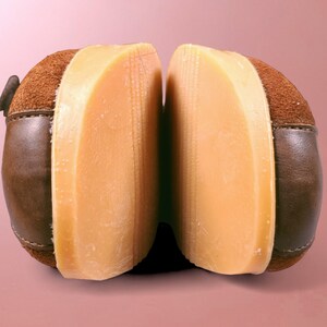 May include: A pair of brown suede shoes with a light brown rubber sole. The shoes are separated to show the sole.