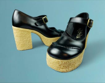 Perfect 70s platform heels. Never worn! Mary jane strap. Crépe sole. Black vinyl. Size 9.