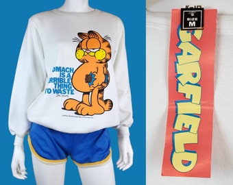 Vintage GARFIELD sweatshirt. Deadstock syndicate 1978. "A Stomach Is a Terrible Thing To Waste" White, blue, yellow, orange. (S)