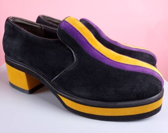 Hush Puppies disco heels. 90s does 70s chunky colorblock psychedelic loafers. Purple & yellow. Hipster disco LA Lakers. (W 7.5)