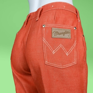 Vintage 60s orange Wranglers. 60s mod. Mid-low rise. Bootcut flare. Like new. Size S.