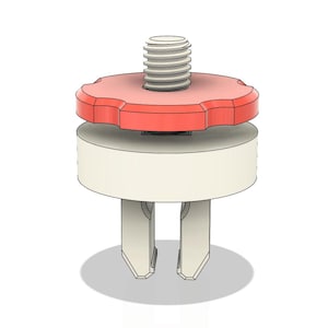 Pode incluir: Um componente renderizado em 3D com um botão vermelho e estriado sobre uma base cilíndrica branca. Um parafuso roscado se projeta do botão. Duas extensões brancas em forma de dentes se projetam da base, sugerindo um mecanismo de fixação.