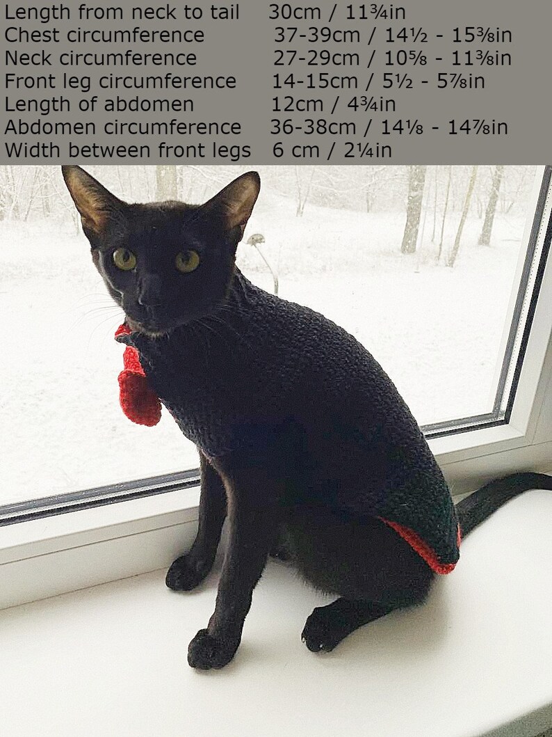 May include: A black cat wearing a red and black sweater sits on a windowsill. The cat's measurements are listed in inches and centimeters. Length from neck to tail: 30cm / 11 3/4in. Chest circumference: 37-39cm / 14 1/2 - 15 3/8in. Neck circumference: 27-29cm / 10 5/8 - 11 3/8in. Front leg circumference: 14-15cm / 5 1/2 - 5 7/8in. Length of abdomen: 12cm / 4 3/4in. Abdomen circumference: 36-38cm / 14 1/8 - 14 7/8in. Width between front legs: 6cm / 2 1/4in.