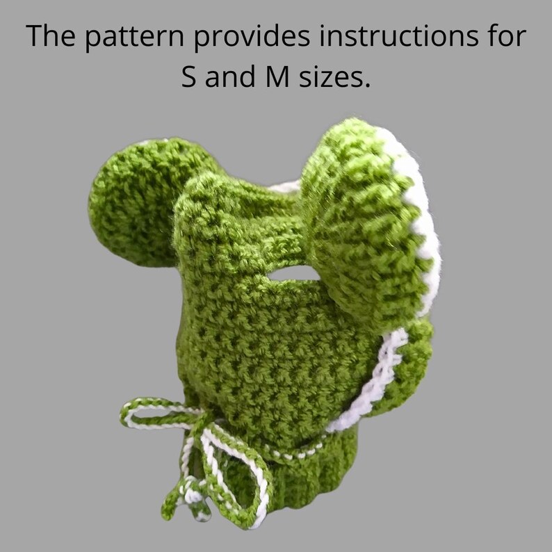 May include: Green crocheted hat with white trim and a bow. The pattern provides instructions for S and M sizes.