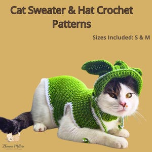 May include: A cat wearing a green crochet sweater and hat with leaf-like accents. The sweater has white trim. The image includes the text "Cat Sweater & Hat Crochet Patterns" and "Sizes Included: S & M".