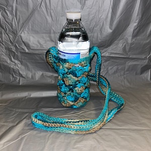 Bolso o cartera tipo bandolera para teléfono o botella de agua con puntadas de estrella abigarradas en verde azulado, azul y marrón. ¡LISTO PARA ENVIAR!