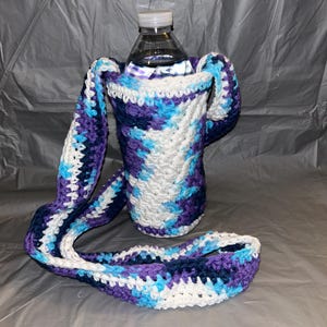 Cartera o bolso tipo bandolera para teléfono o botella de agua con puntadas de estrellas en azul, morado y blanco. ¡LISTO PARA ENVIAR!