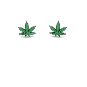 May include: A pair of small, silver-toned earrings with green marijuana leaf designs.
