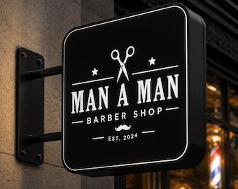 Könnte beinhalten: Ein schwarzes, quadratisches Wand-Schild mit abgerundeten Ecken und weißem Text, der MAN A MAN BARBER SHOP EST. 2024 lautet. Das Design enthält eine Grafik einer Schere, zwei Sternen und einem Schnurrbart, die mittig auf dem Schild platziert sind.