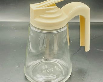 Dispensador de jarabe Gemco vintage con tapa para crema, fabricado en EE. UU., de vidrio y plástico.