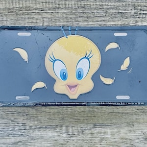 May include: A rustic wooden sign with the text "Welcome to our home" in white lettering. The sign features a distressed finish and a simple, inviting design, perfect for a front porch or entryway.