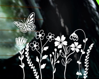 Peut inclure: Silhouette blanche d'un papillon et de fleurs sur un fond noir. Le papillon est dans le coin supérieur gauche de l'image. Les fleurs sont dans le coin inférieur droit de l'image.