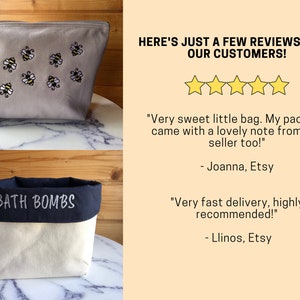 May include: Two handmade fabric storage containers. The first is a gray zippered pouch with embroidered bees. The second is a white canvas container with a navy blue top and the text "BATH BOMBS" embroidered on the top. The image includes customer reviews with five stars and text that reads "HERE'S JUST A FEW REVIEWS FROM OUR CUSTOMERS!"