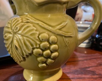Embossed ceramic creamer