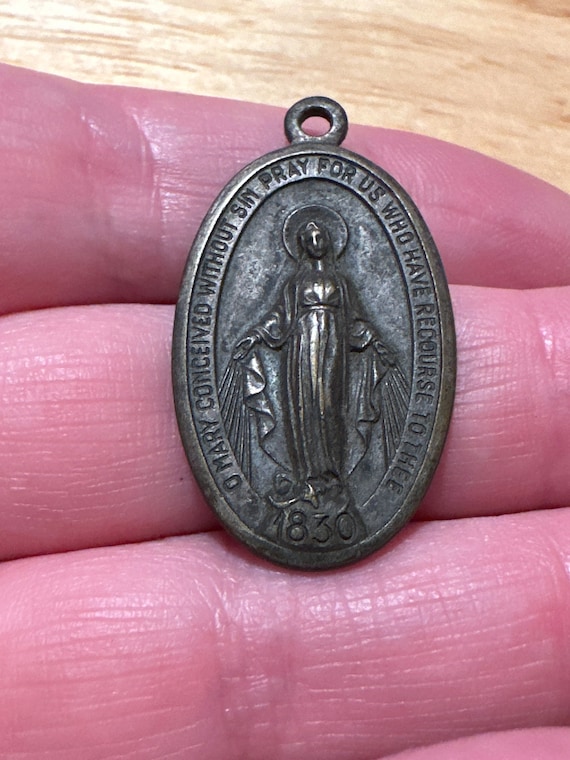 Miraculous Mary religious pendant