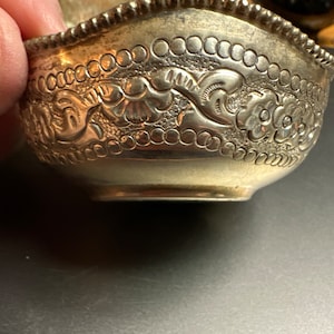 Small embossed silver dish