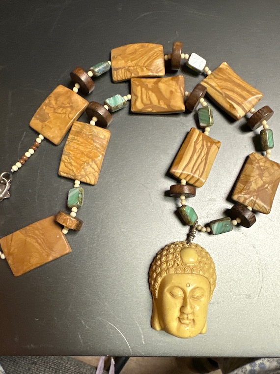 Carved Buddha face necklace - image 1