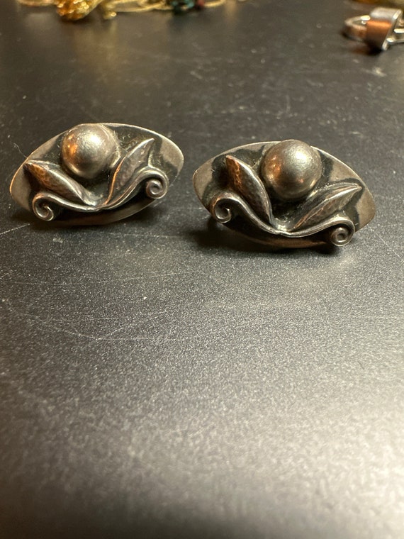 Gorgeous pair of sterling screw back earrings.