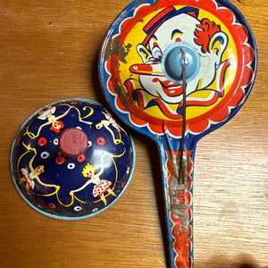 Two vintage tin noisemakers