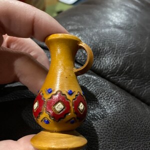 Tiny painted and engraved wood jug