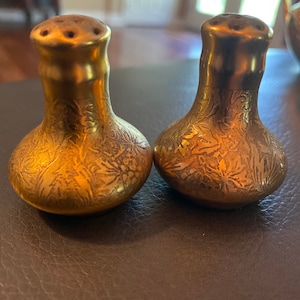Beautiful gold gilded salt and pepper shakers