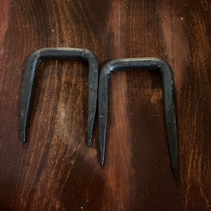 Hand forged iron spikes