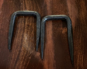 Hand forged iron spikes