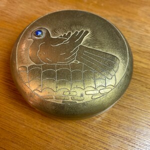 Brass trinket box with bird on nest design
