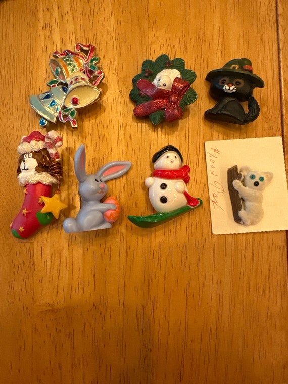 Collection of vintage holiday pins plus a koala.