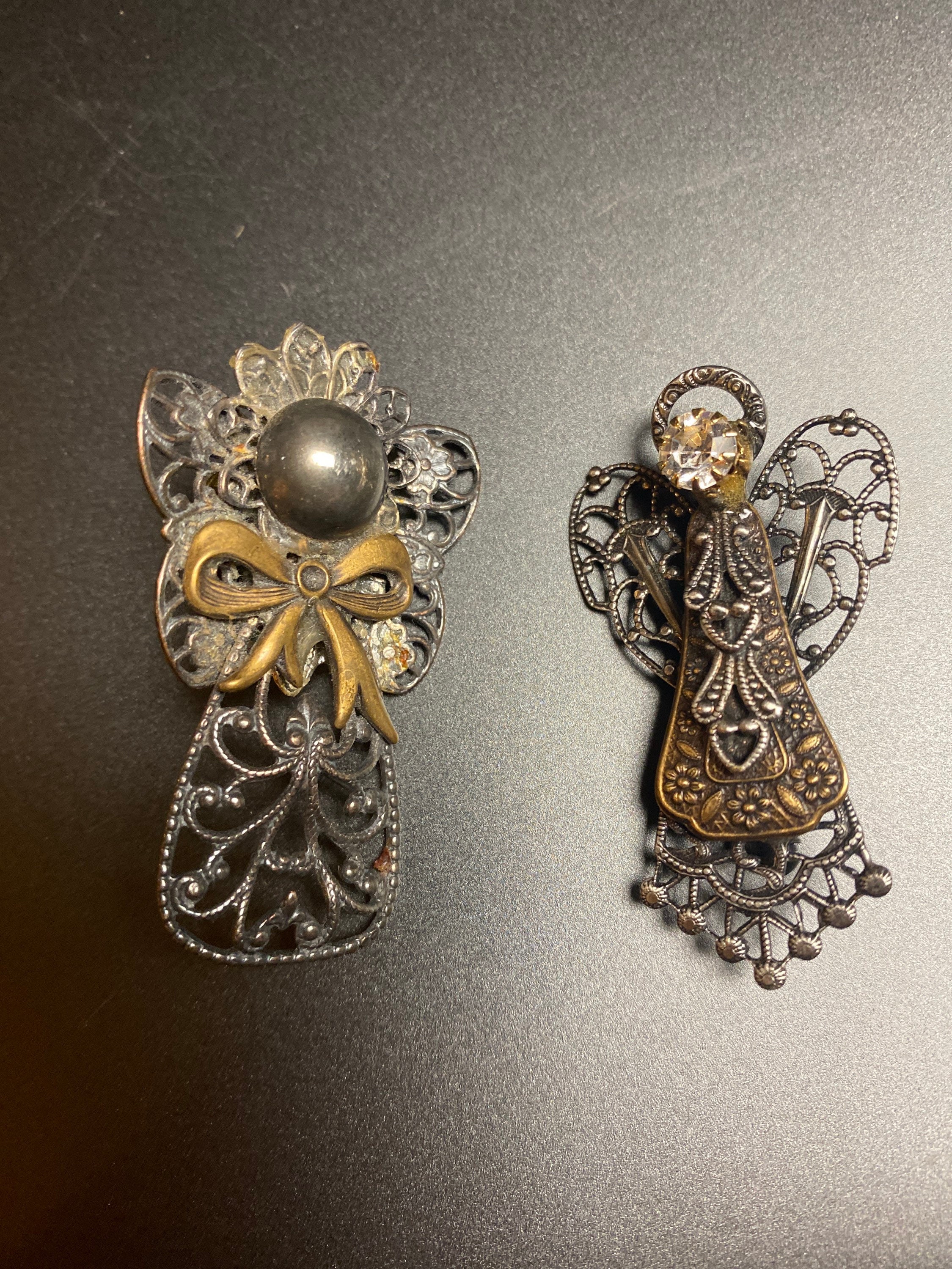 2 pieces of silver tone angel pins
