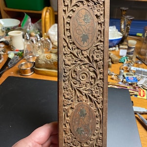 Carved wood box holding two decks of cards. From India.