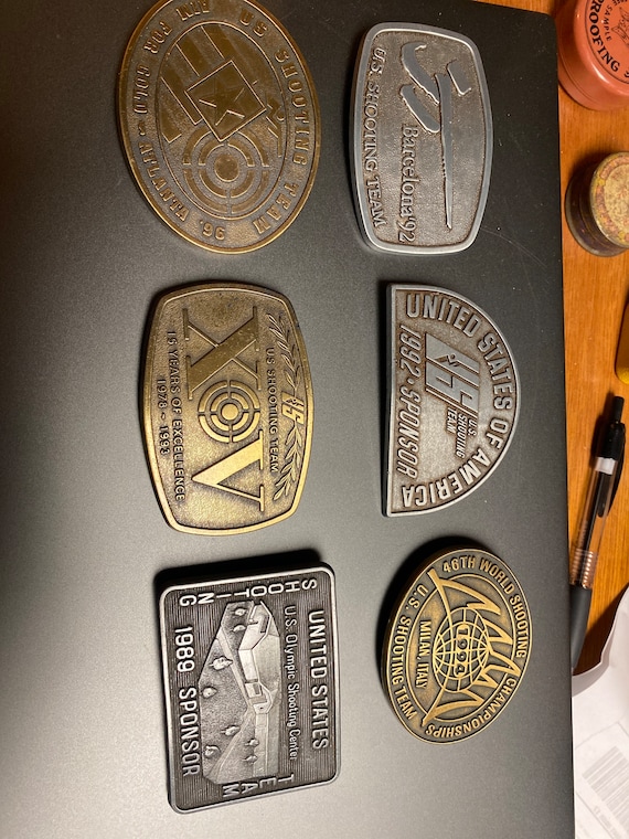 Collection of US shooting team belt buckles