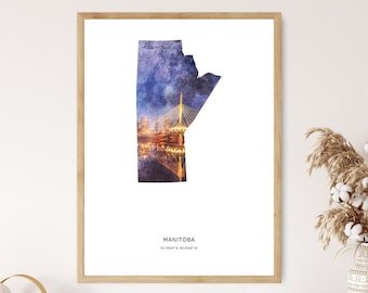 May include: A watercolor print of the outline of the Canadian province of Manitoba, filled with a cityscape of Winnipeg at night. The print includes the text "MANITOBA" and the coordinates "53.7609° N, 98.8139° W".