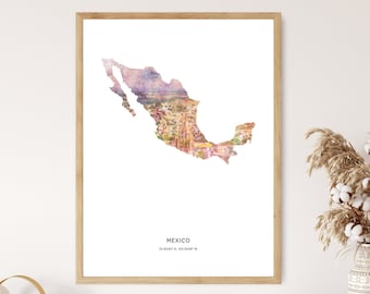 May include: A watercolor print of Mexico with a cityscape overlay. The print is framed in a light wood frame and has the text "MEXICO 23.6345° N, 102.5528° W" at the bottom.