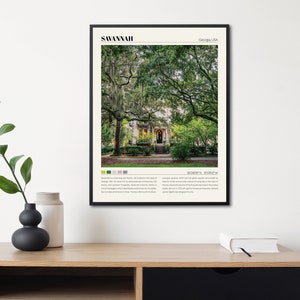 May include: A black and white poster with a photograph of a house with a green lawn and trees in Savannah, Georgia, USA. The poster includes the text "Savannah, Georgia, USA" and "32.0800&deg;N, 81.0922&deg;W".