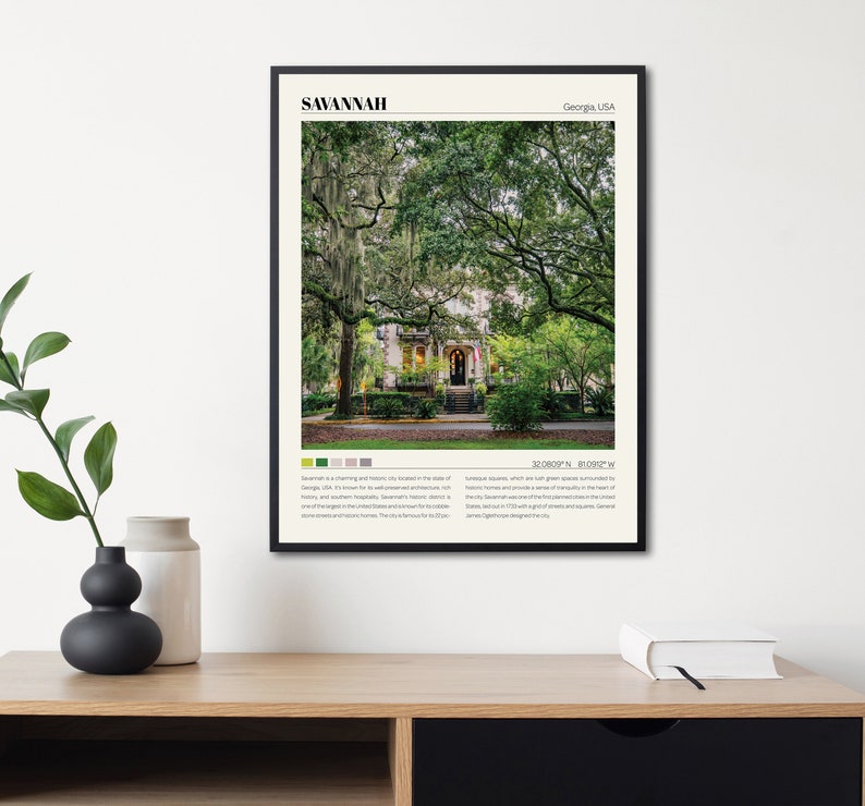 May include: A black and white poster with a photograph of a house with a green lawn and trees in Savannah, Georgia, USA. The poster includes the text "Savannah, Georgia, USA" and "32.0800&deg;N, 81.0922&deg;W".