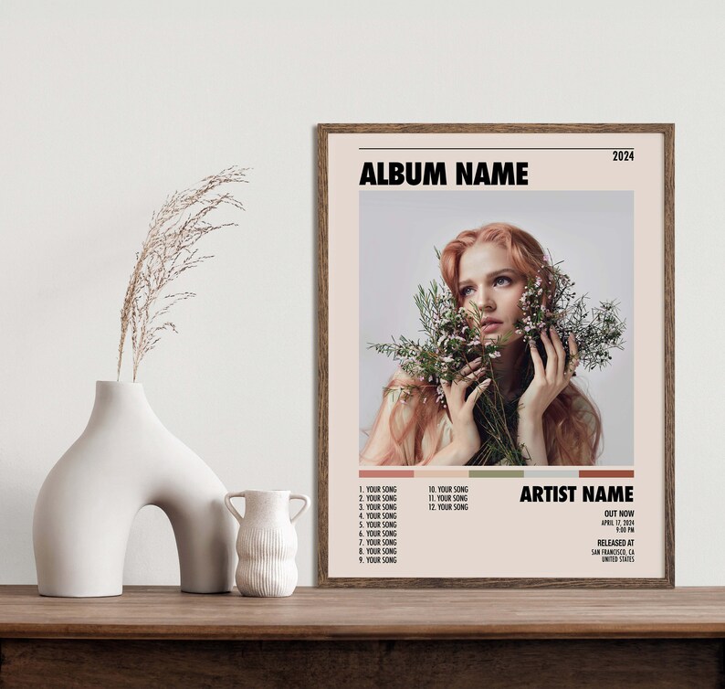 May include: Album cover art featuring a woman with long red hair holding a bouquet of white flowers. The album title is "ALBUM NAME" and the artist name is "ARTIST NAME". The album was released in 2024.