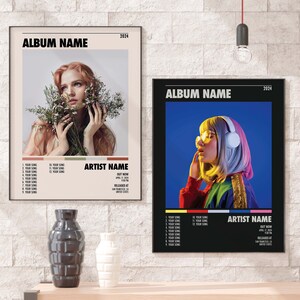 May include: Two album covers with black frames and white text. The album covers feature a woman with red hair and a woman with pink and blue hair. The album covers have the title "ALBUM NAME" and the year "2024".