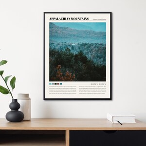 May include: A black and white poster with the text "Appalachian Mountains" in bold, black font. The poster features a photograph of a lush, green mountain range with a blue sky in the background. The text "Eastern United States" is in smaller, black font below the title. The poster also includes a color palette and coordinates.