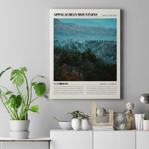 May include: A vintage-style poster with a photograph of the Appalachian Mountains in the Eastern United States. The poster has a blue, green, and white color scheme and includes the text "APPALACHIAN MOUNTAINS" and "36.0525&deg;N 81.0798&deg;W".