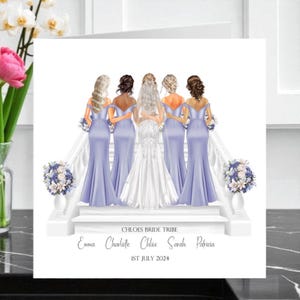 May include: A greeting card featuring a bride and bridesmaids in lavender gowns, standing on a white staircase. The card includes the text "CHLOES BRIDE TRIBE", names, and the date "1ST JULY 2024". Decorative floral arrangements are on the staircase.