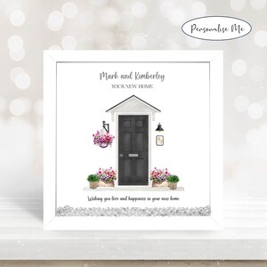 May include: A white card with a black door and flowers. The card says "Mark and Kimberley, Your New Home" and "Wishing you love and happiness in your new home".