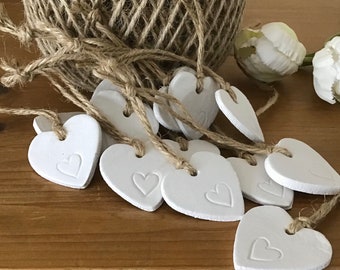 6 Small white clay heart tags