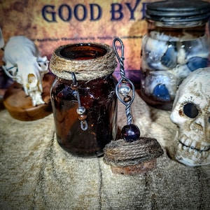 Antique apothecary bottle with decorative topper